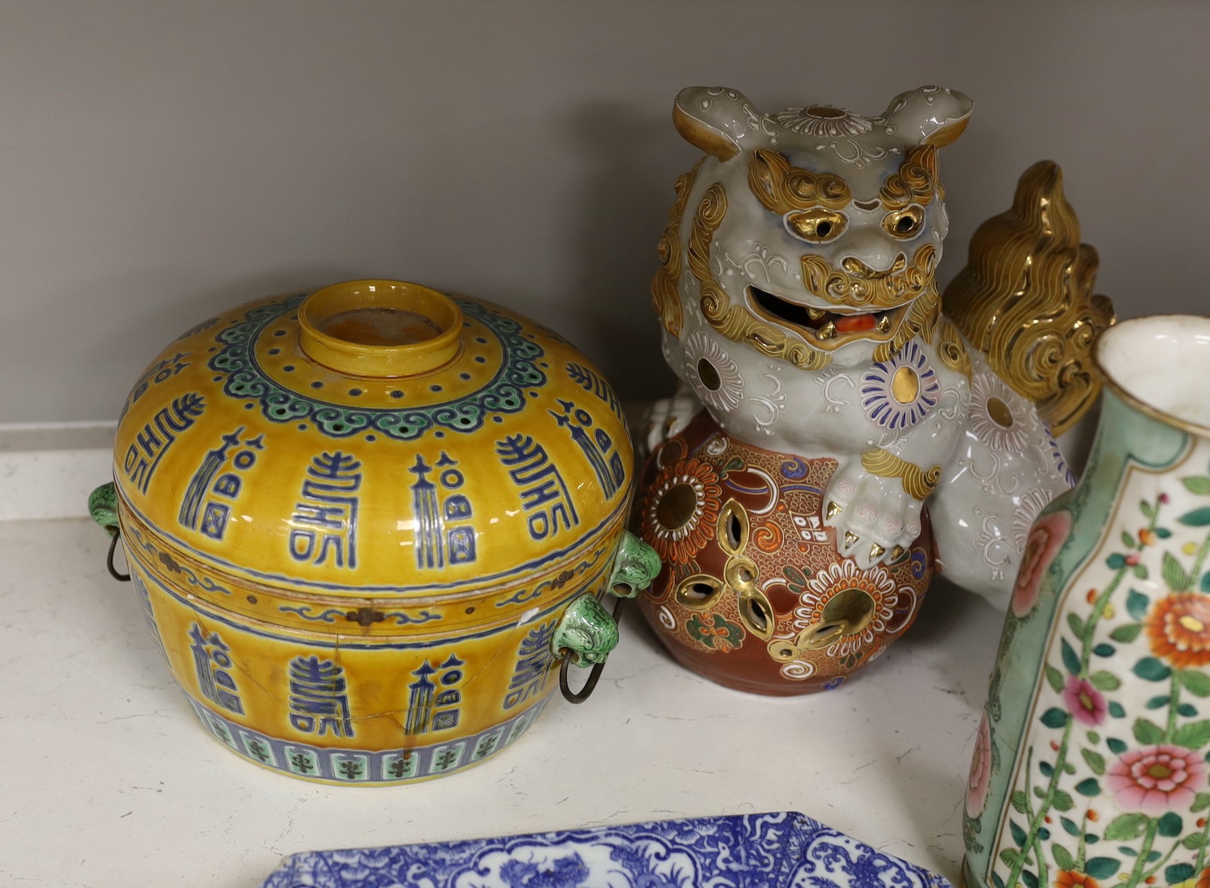 A collection of mostly Chinese ceramics, to include a vase, a lion dog, pestle and mortar etc.